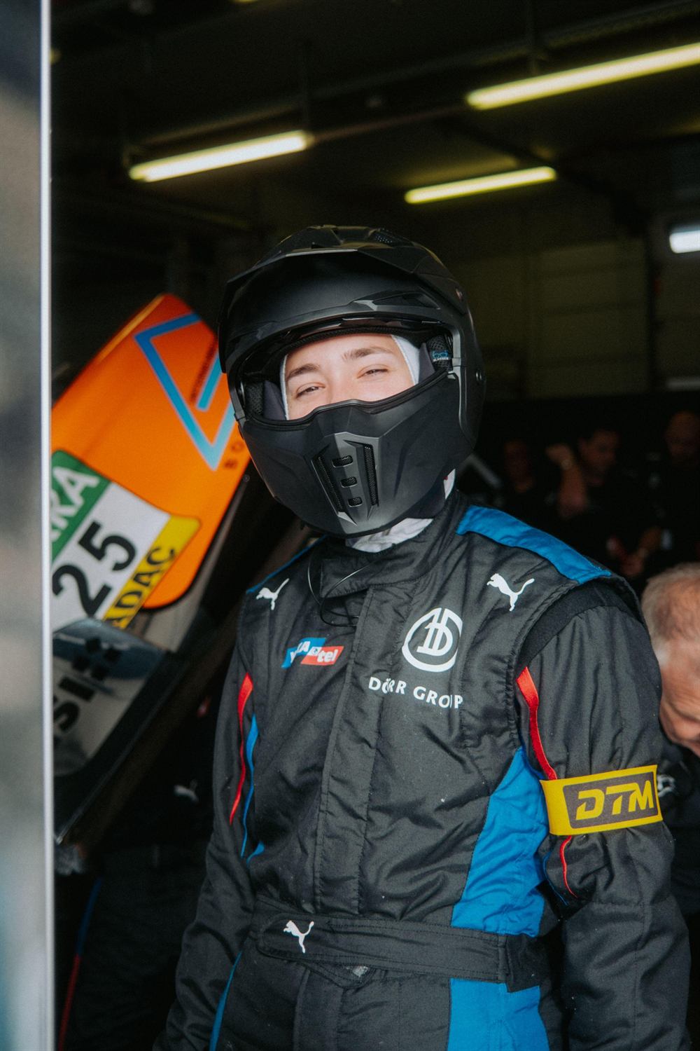 Mandy Paschen with helmet and DTM badge in the pit